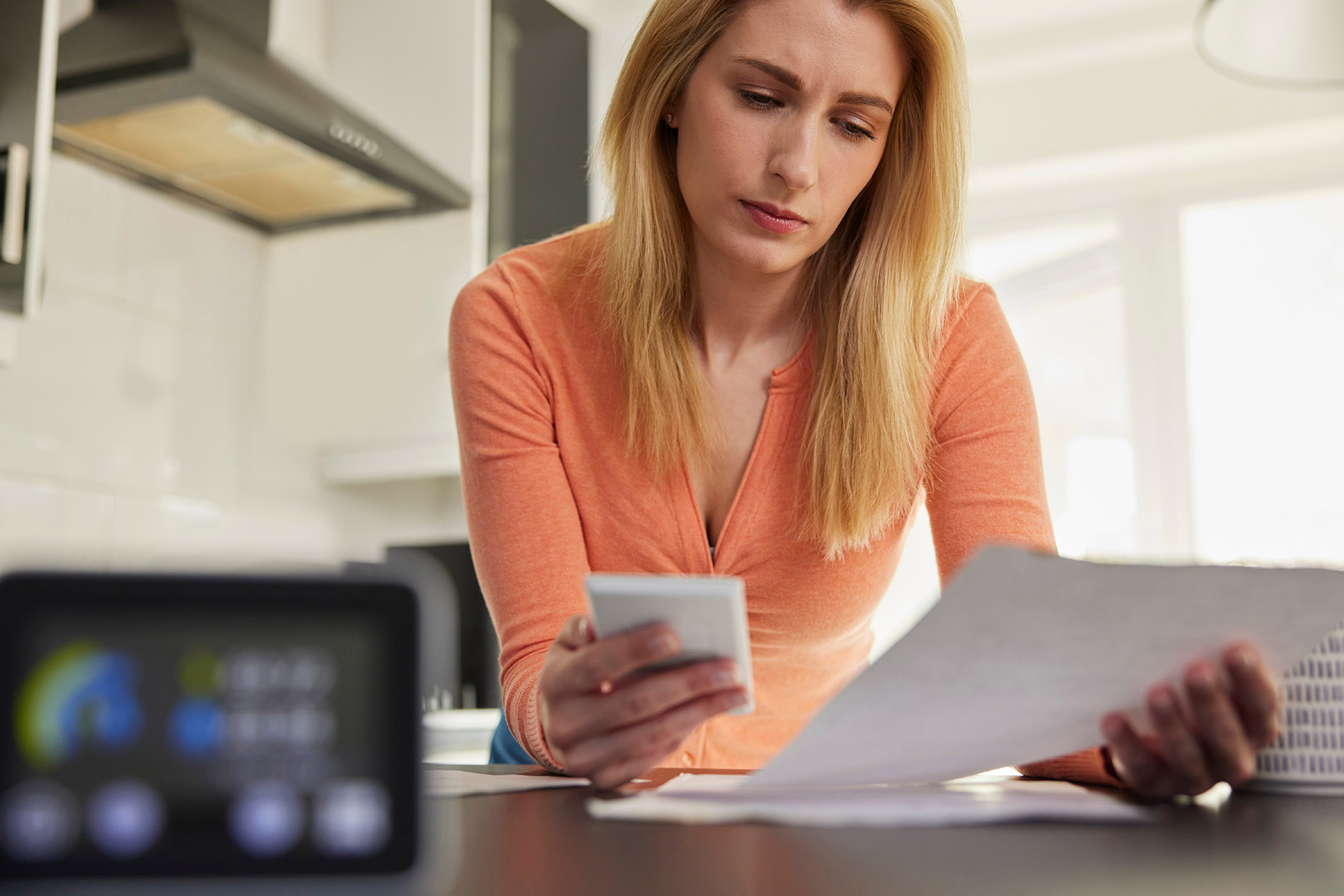 Electricity Prices Are Rising | Photo of Woman Paying Electric Bill