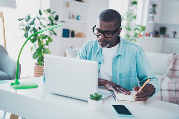 Direct Energy Rates Photo of Man Looking at Bill