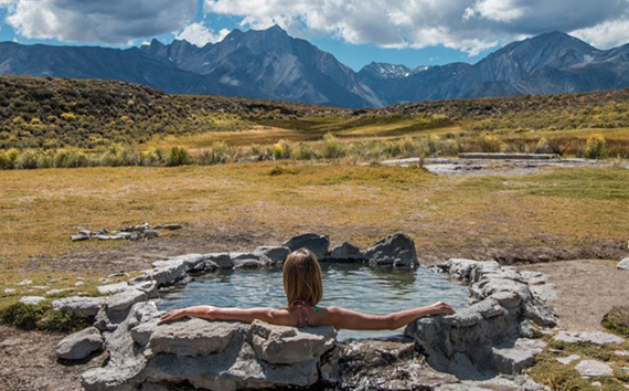 Geothermal Energy Types Woman Sits in Pond