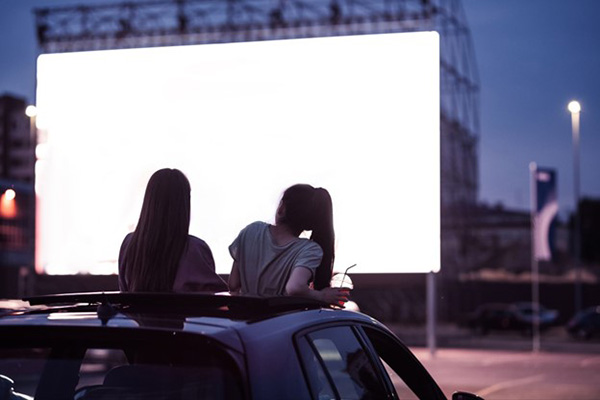 Lubbock Texas.Two Girls Enjoy Drive in Movie