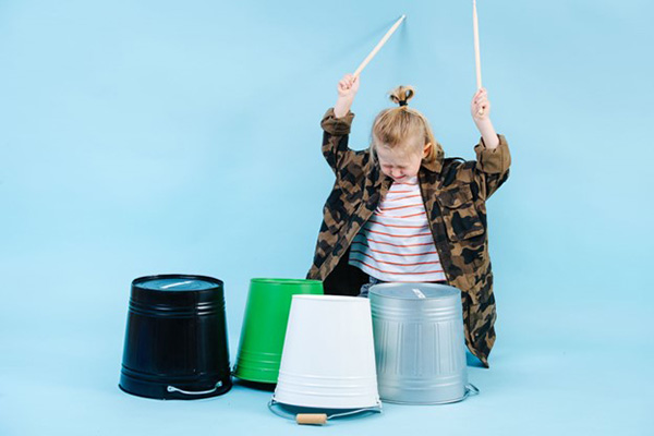Sound Energy Definition Small Child Plays Drums on Containers