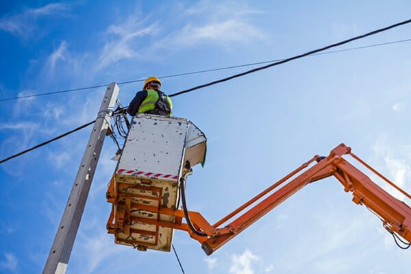 Electrician Works on Fixing Powerline