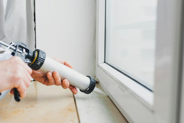 Silicone Stop Air Leaks Man Applies Caulking Silicone Stop Air Leaks Man Applies Caulking