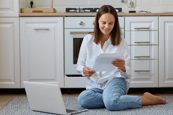 Shrink Utility Bills and Your Carbon Footprint Woman Happy